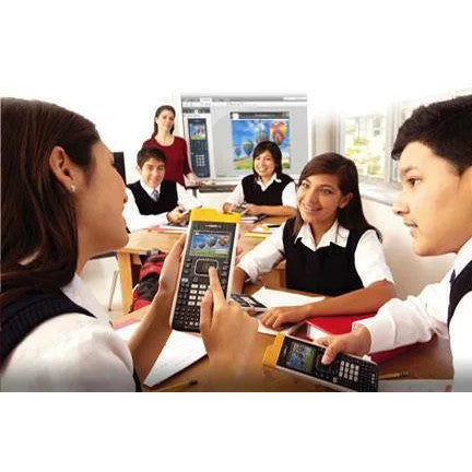 Students in classroom using Texas Instruments TI-Nspire CX calculators with teacher at whiteboard