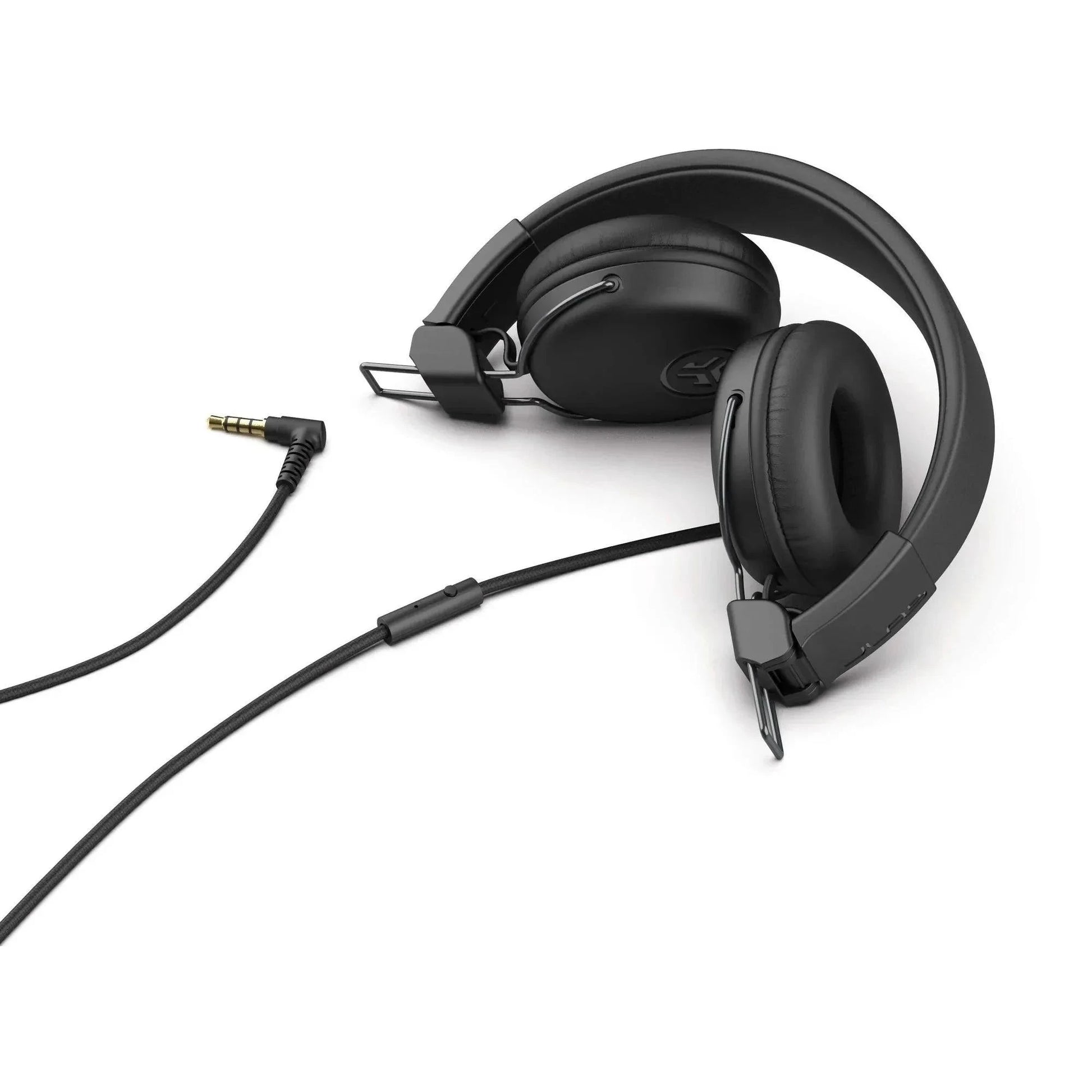 JLab Studio wired headset with padded ear cups and 3.5mm audio jack on white background