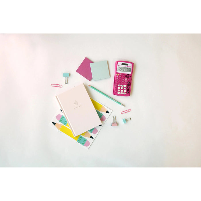 Pink TI-30XIIS scientific calculator with stationery on white desk, Underwood Distributing Co.