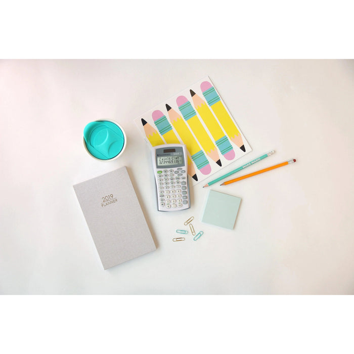 TI-30XIIS scientific calculator on white desk with pencils, planner, paper clips, and notepad.