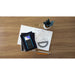 TI-Nspire CX II CAS graphing calculator on notebooks with math notes, protractor, pencils, and plant