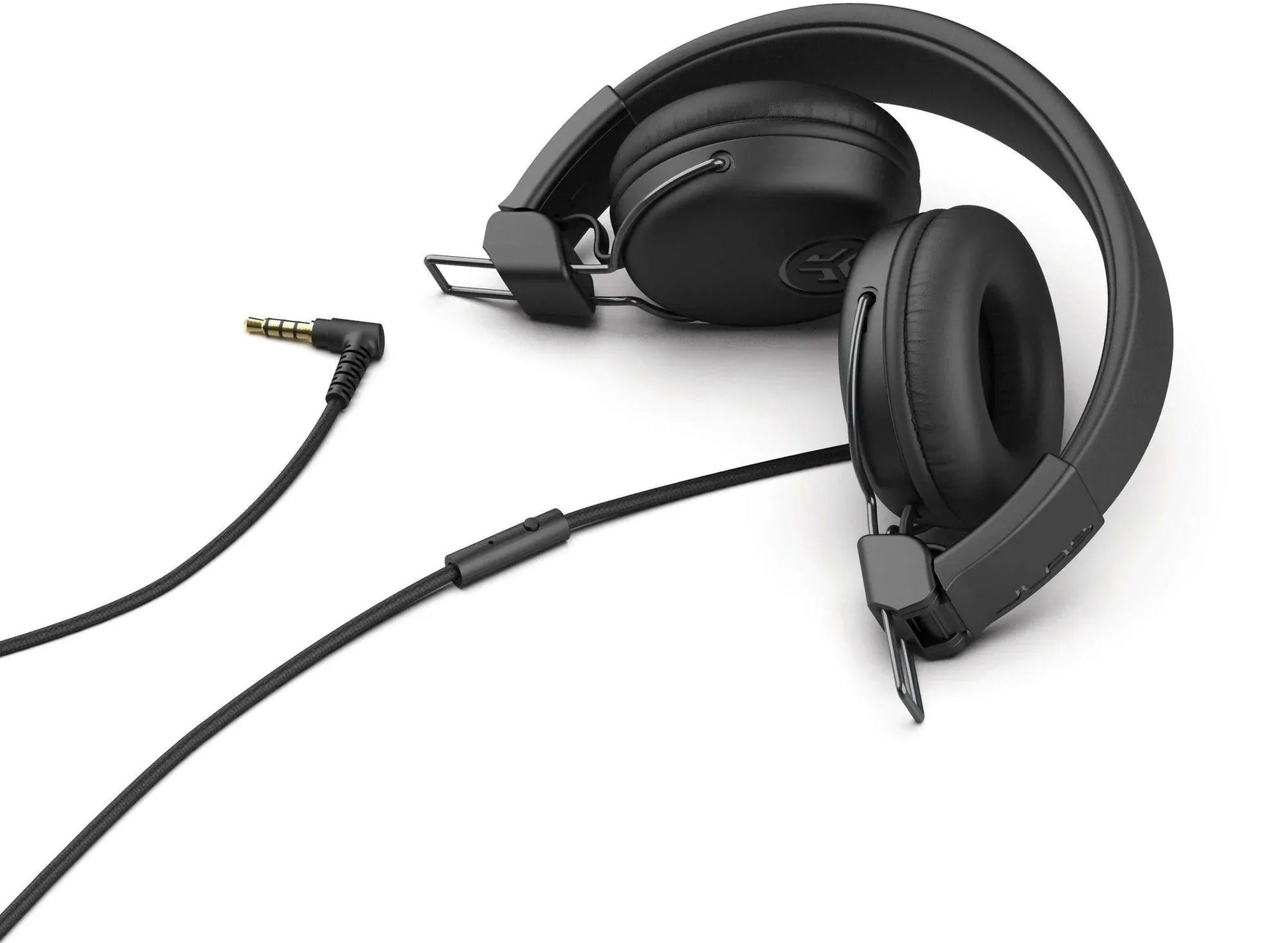 JLab Studio wired headset with padded ear cups and 3.5mm audio jack on white background